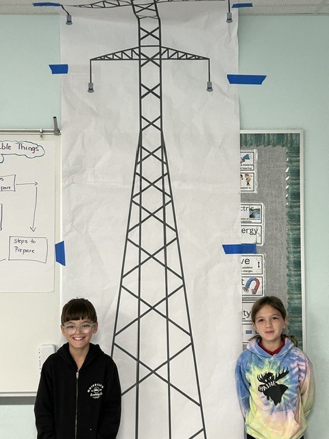 Two students posing for a picture in Mrs. Mac's classroom.
