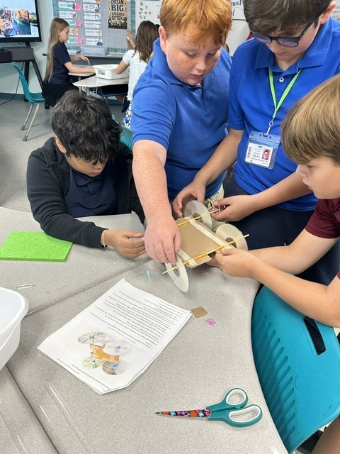 5th Grade students collaboratively working on STEM activity.