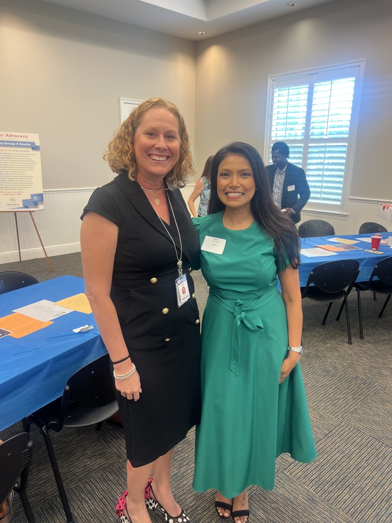 Dr. Christina Jacobs, Chief of Staff, and Dr. Kyra Schafte, Director of Strategic Communications and Marketing for the School District of Indian River County, smile together at the Realtors Association of Indian River County event on October 15, 2026.