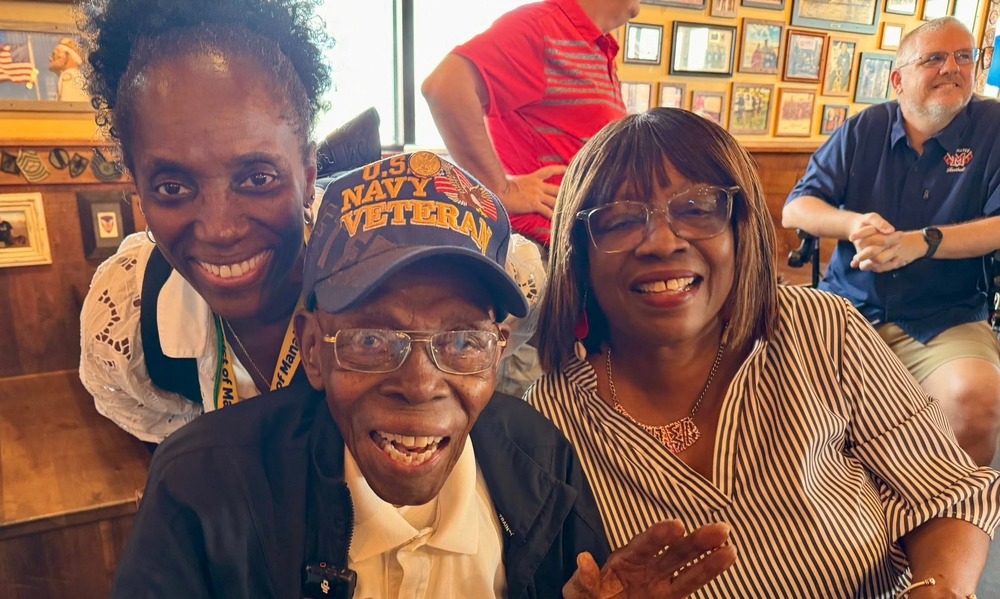 Coach Eddie Shannon, his daughter, and granddaughter celebrate his 104th birthday at Mission BBQ