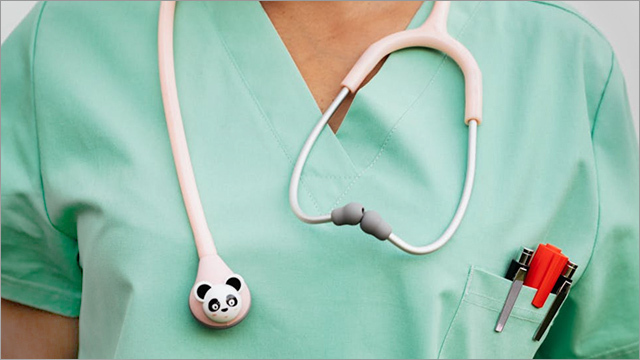 nurse wearing a stethoscope with a fun cartoon character on it