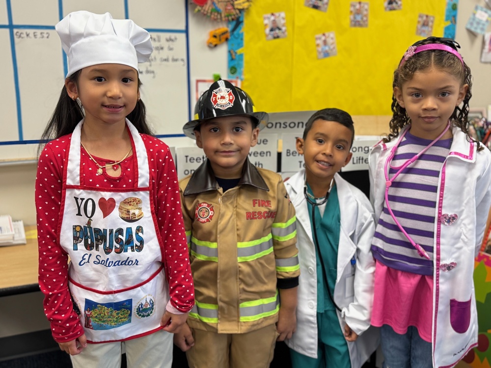 Students dressed up as a chef, firefighter, doctor and nurse.