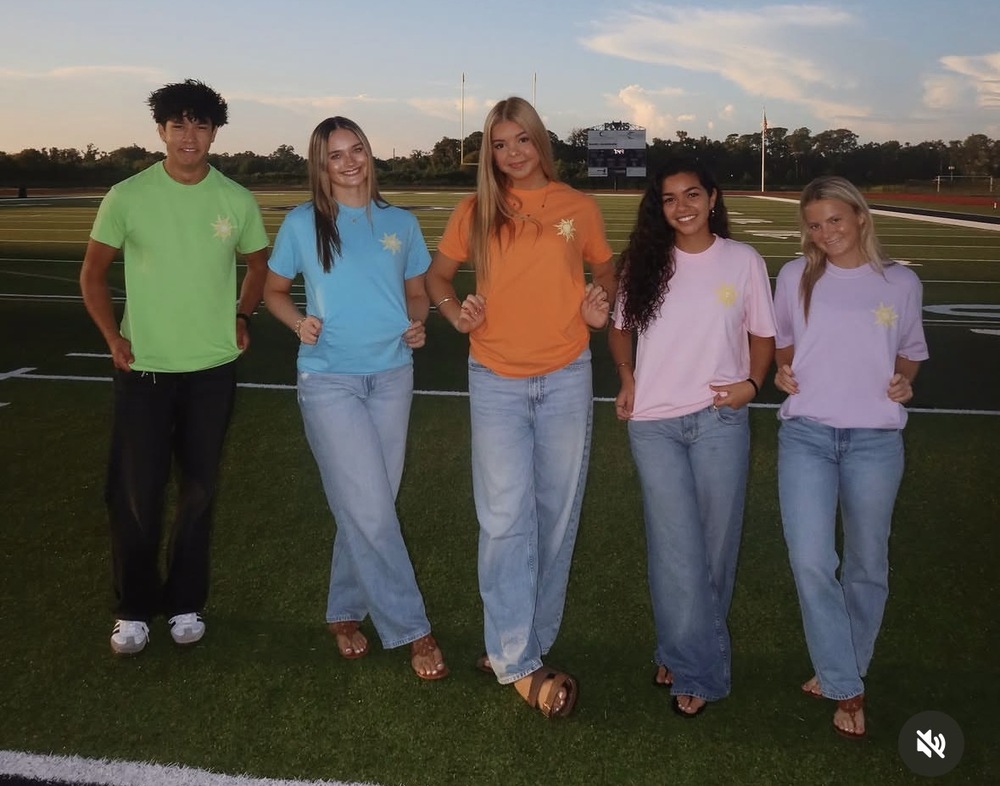 SGA officers showing class shirts for homecoming