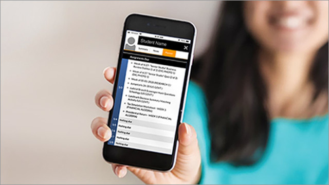 mom holding cell phone with app