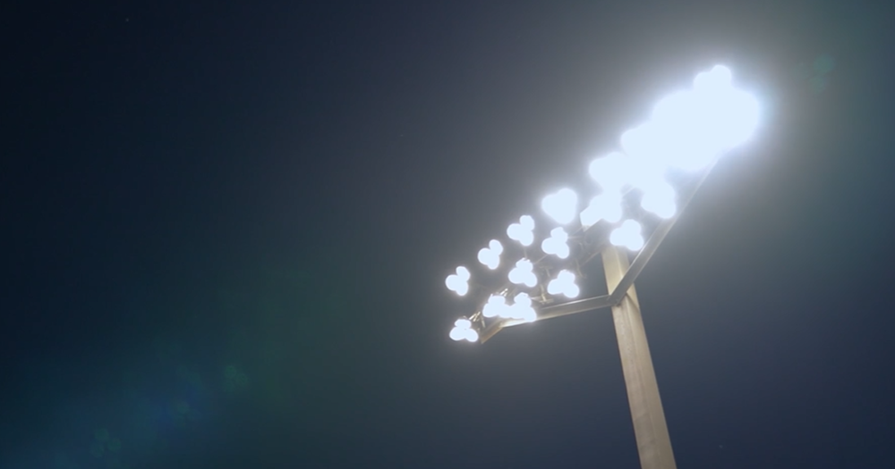 Football lights in a dark night sky.