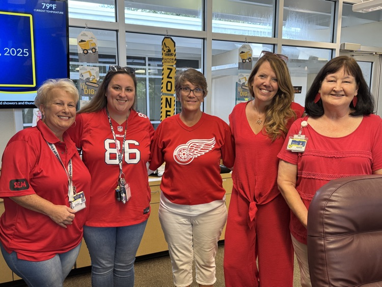 School office staff wearing red in support of color days