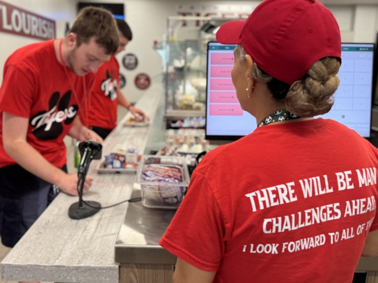 A food service workers T-shirt, which says she looks forward to all the challenges ahead