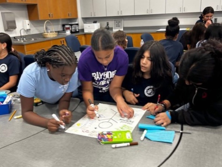 students in a classroom working on schoolwork