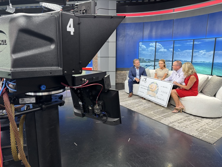television cameras in the studio during an interview of adults