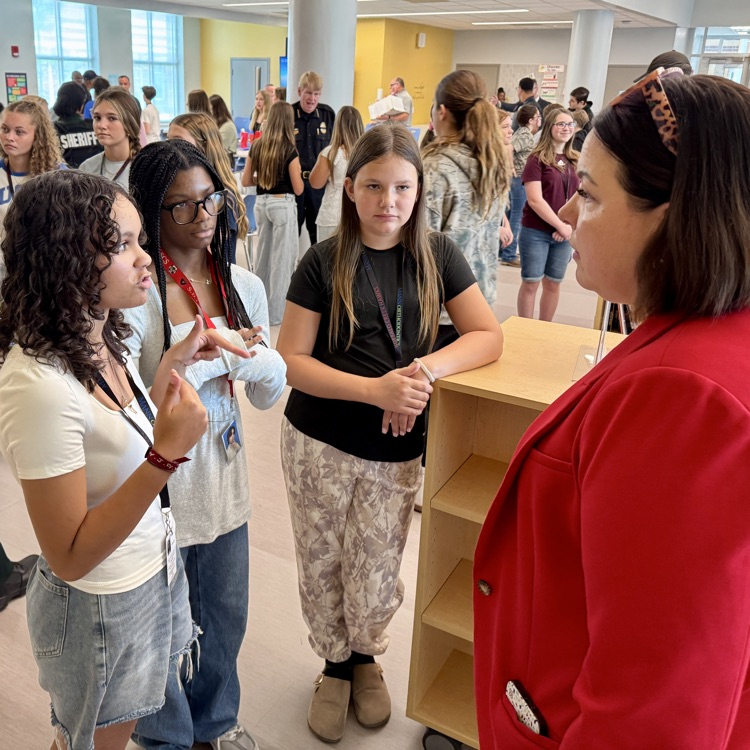 an army veteran speaks with young women about her career