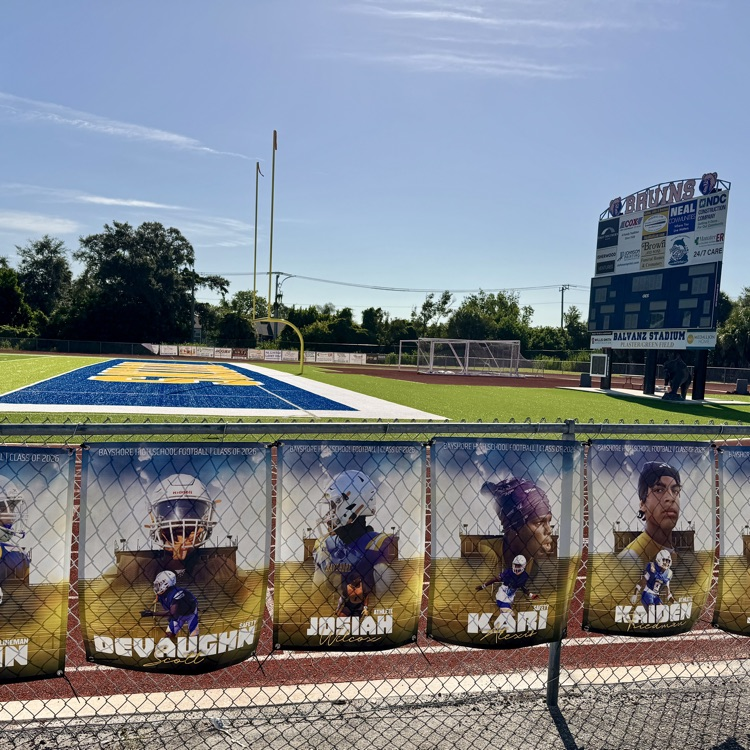 posters featuring high school athletes on a football field