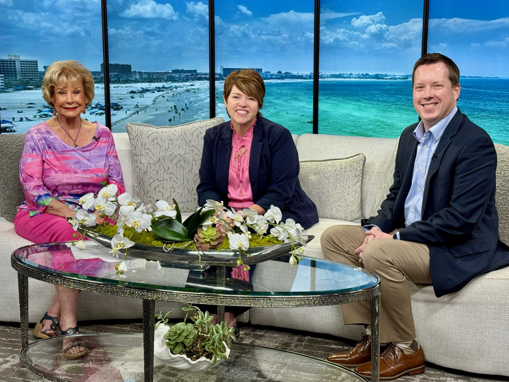 ABC 7 anchor Linda Carson with Debra Estes and Derek Jensen, leaders from the Manatee County School District