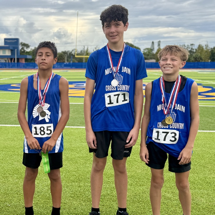 Three young men who plays first second and third at a cross country meet