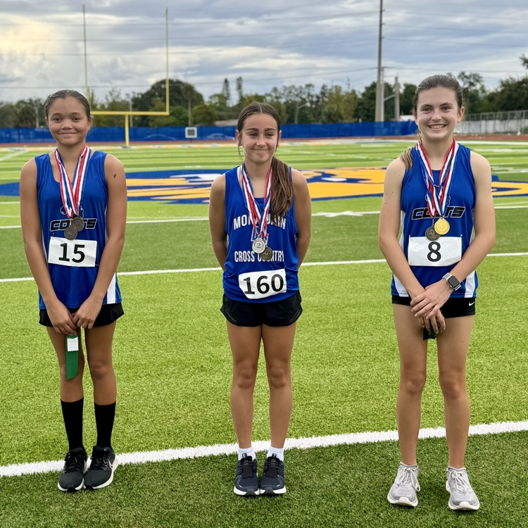 Three young women who plays first second and third at a middle school track meet