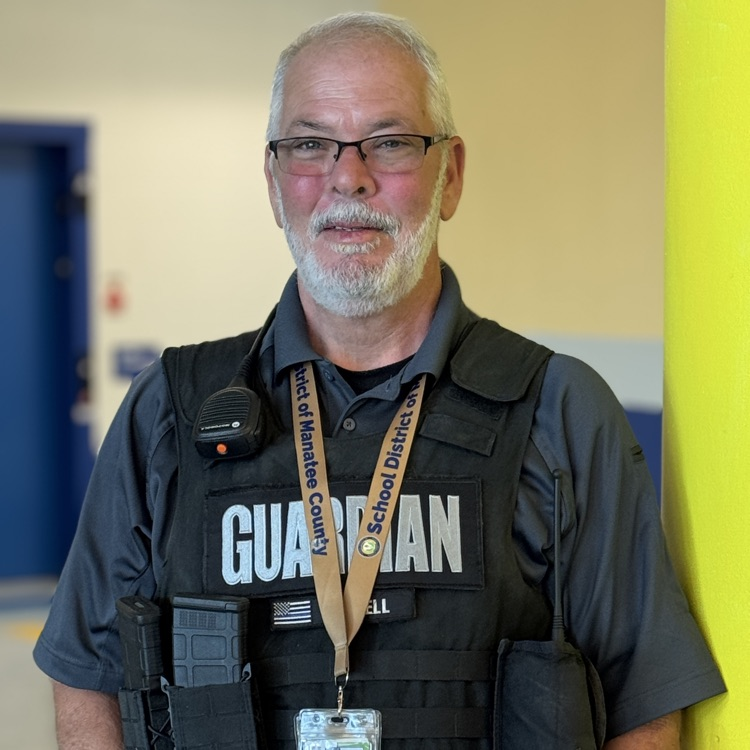 A school safety guardian smiles