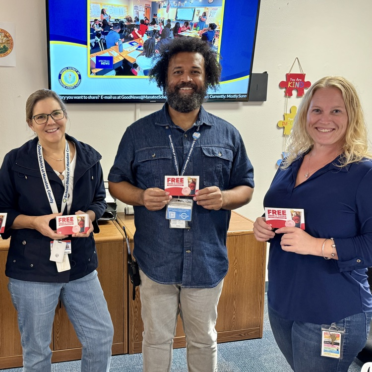 school staff holding certificates for a free drink or cookie at swig