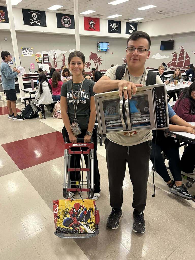 A high school student brought an air fryer to school to carry his books on "Anything but a backpack" day.