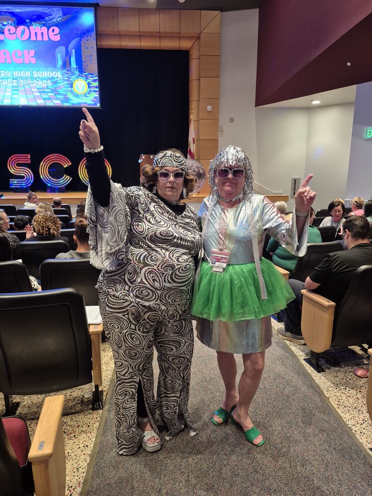 Two women dressed up in costumes
