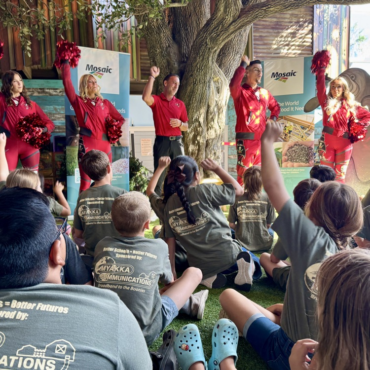 students and cheerleaders do a cheer for the Buccaneers