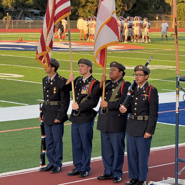 JROTC members hold the flags before Friday night football game at Southeast high