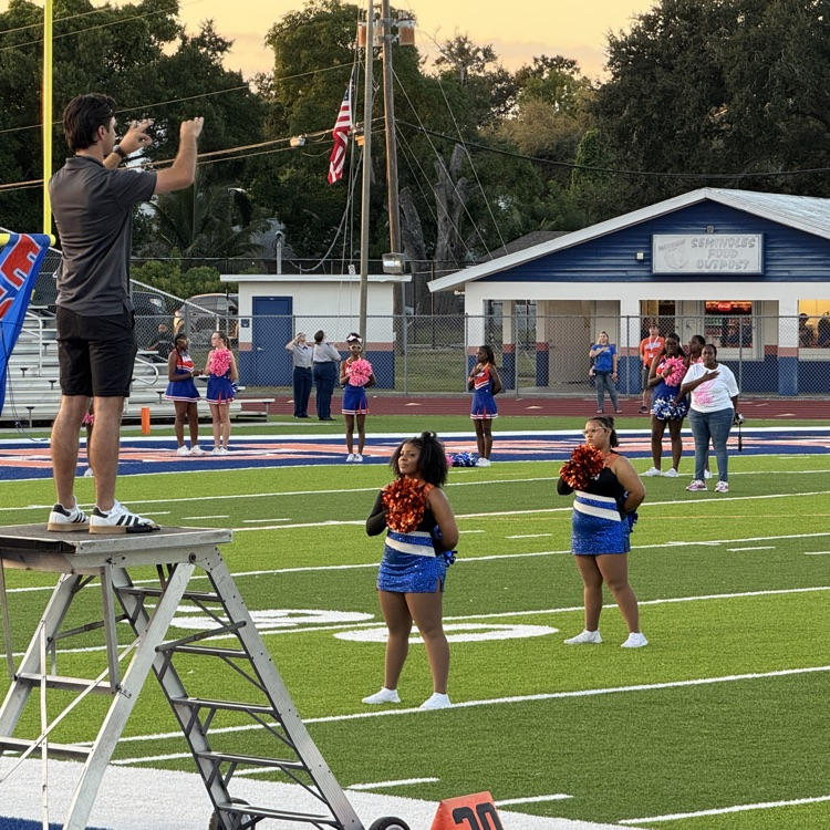Southeast High’s band director conducts on Friday night
