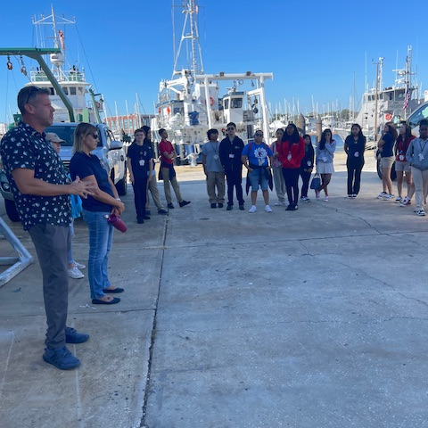 students on a dock, learning more about careers on the water