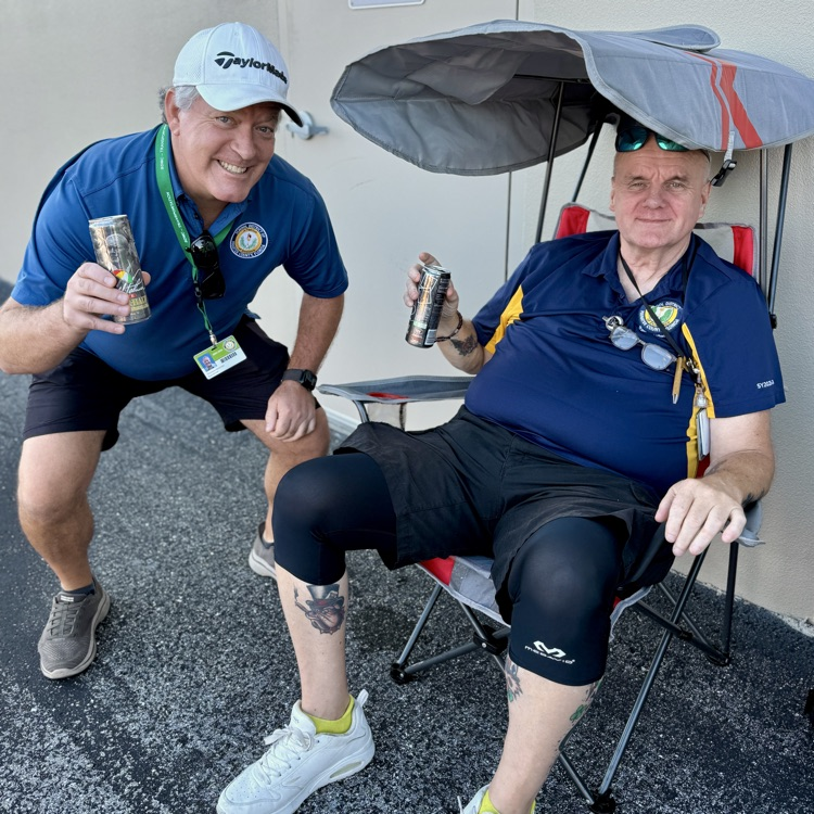 bus drivers watch from the sidelines at the school bus rodeo