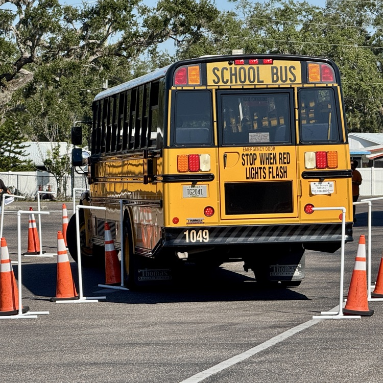 A school bus maneuvers through an obstacle course during the bus rodeo