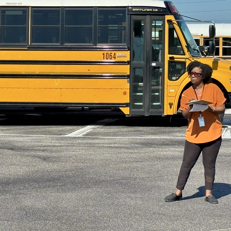 A judge for the school bus rodeo analyzes what drivers are doing on the road