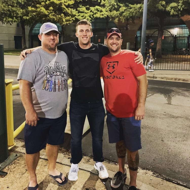former high school baseball player with his coaches