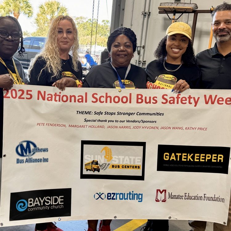 School bus, transportation, employees holding a banner with all their sponsors