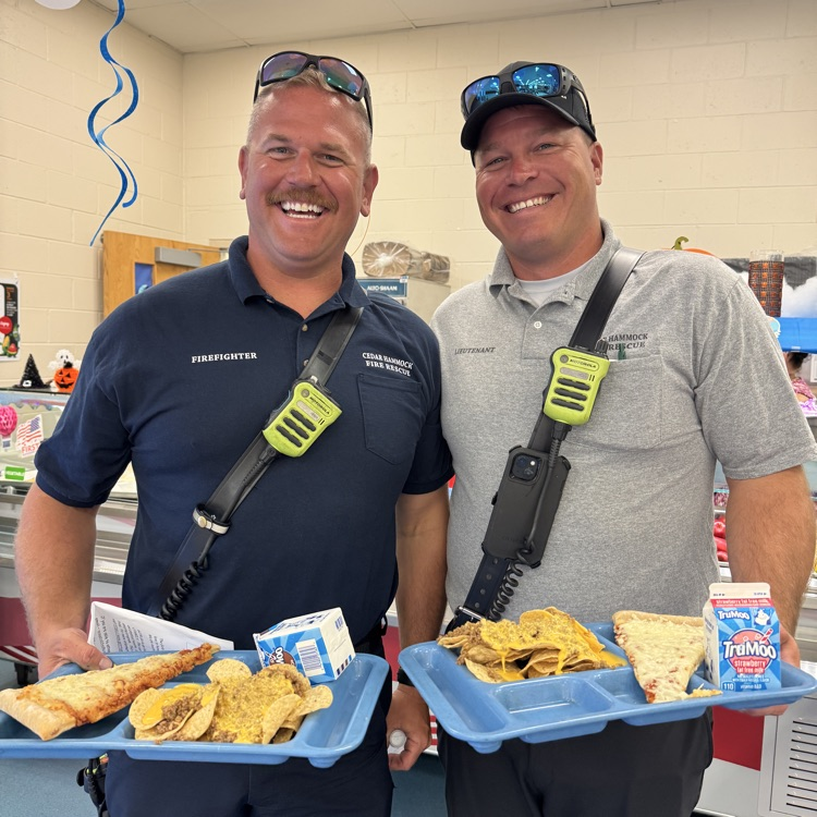 A pair of first responders go back to school to enjoy lunch on national first responders Day