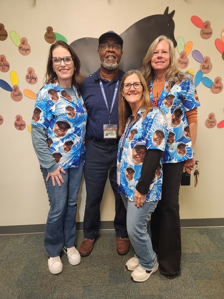 Three women wearing shirts with the face of their beloved courier who is retiring at the end of the month