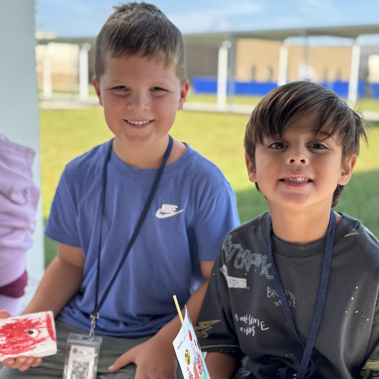 A pair of young engineers smiled during the first ever Thanksgiving boat race at Lake Manatee K-8