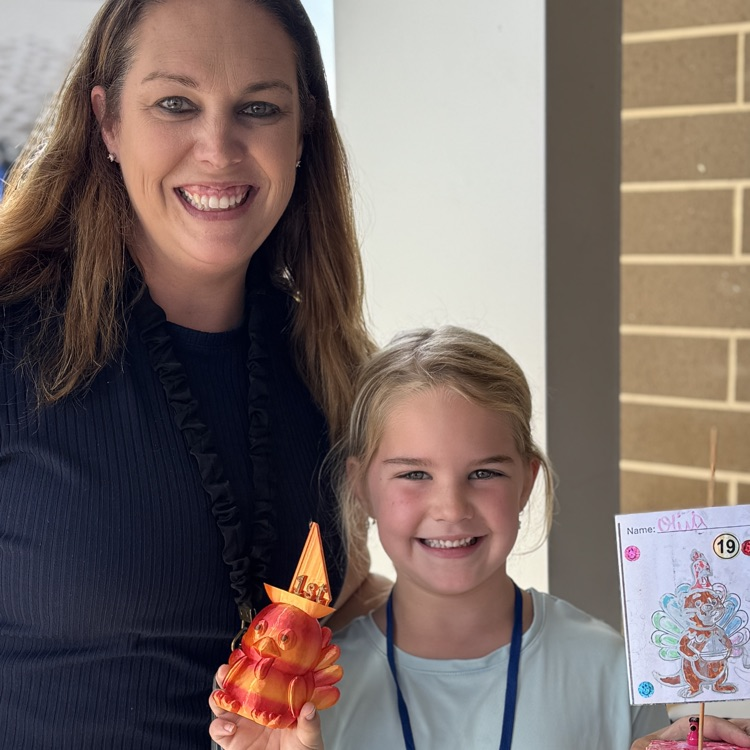 A mother joins her daughter who won first place in the Thanksgiving boat race