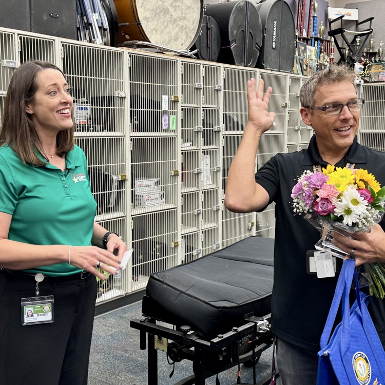 A teacher of the year, final celebrates after being surprised by the superintendent with good news