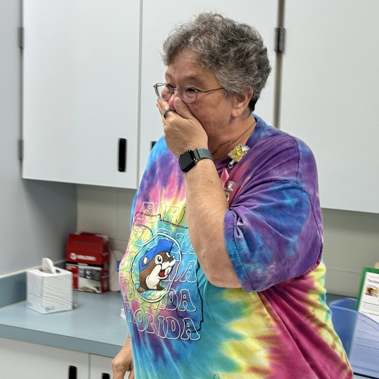 A long time district employee receives words she is a finalist for employee of the year