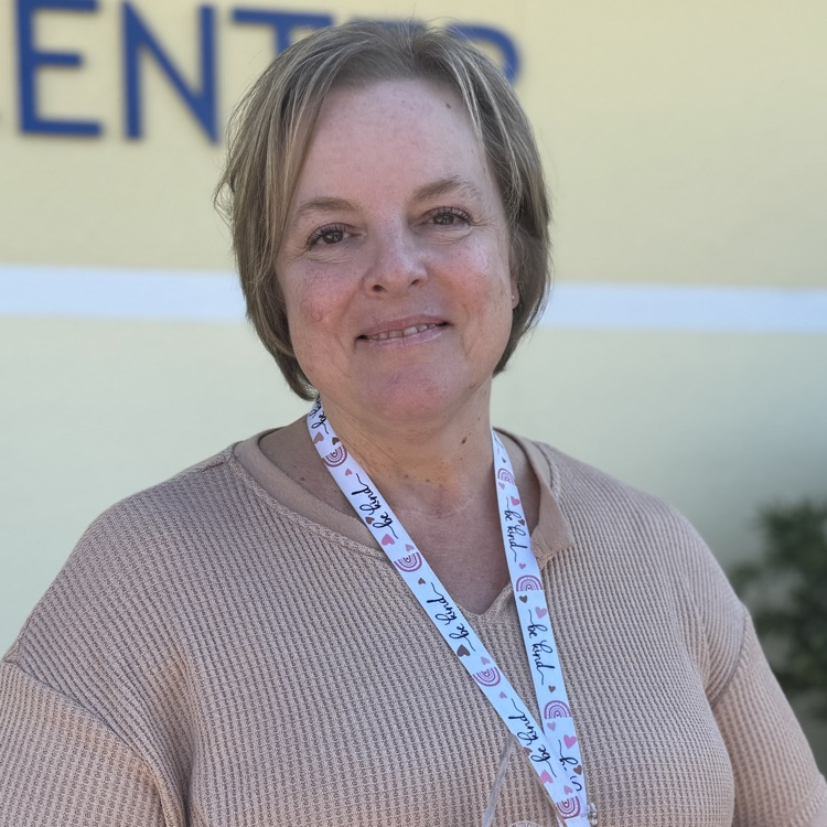 A school support employee is surprised as an employee of the year finalist