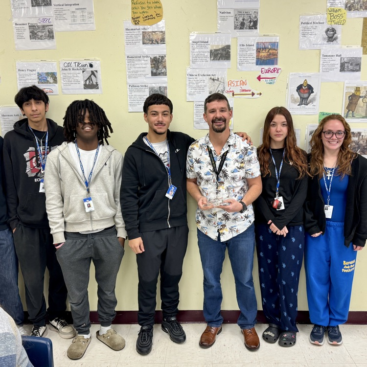 A teacher of the year finalist is celebrated by students