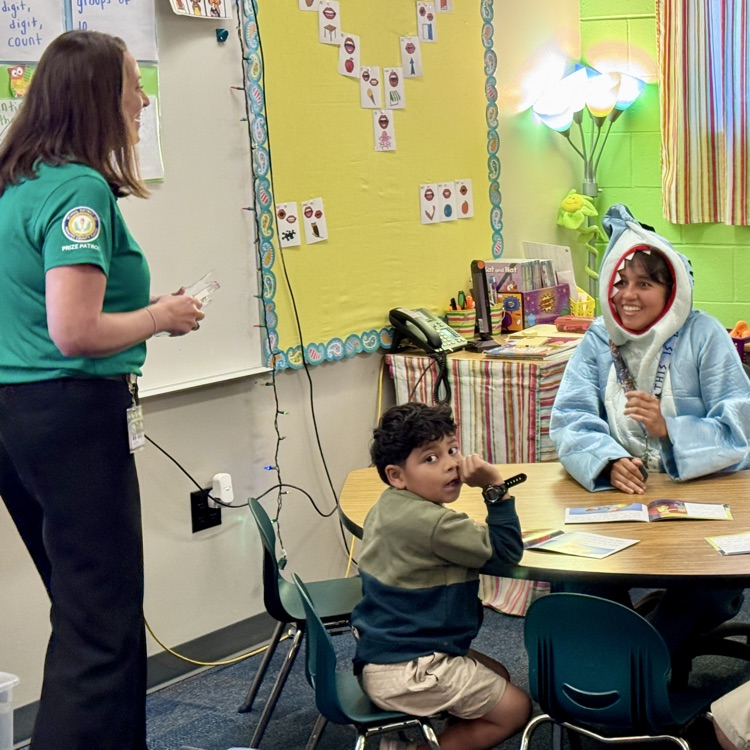 An employee wearing a short costume is surprised at school