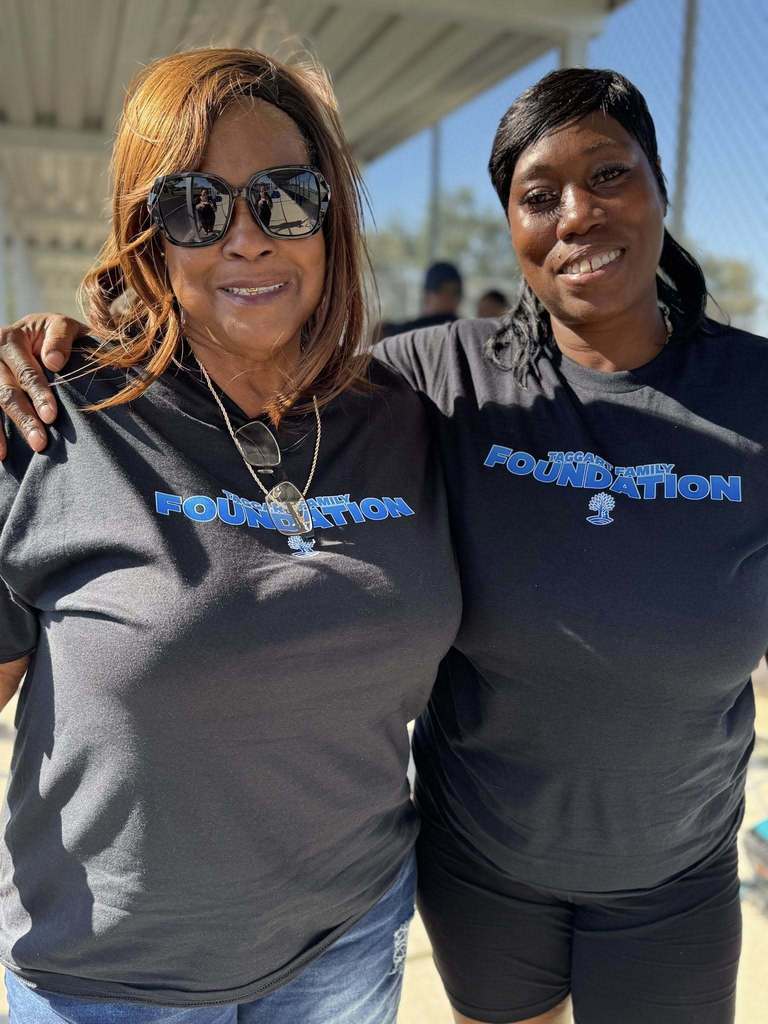 Family and friends of Coach Willie Taggart attending a turkey giveaway sponsored by his foundation in Palmetto.