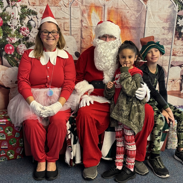 Santa and the chief elf joined children on the last day before winter break