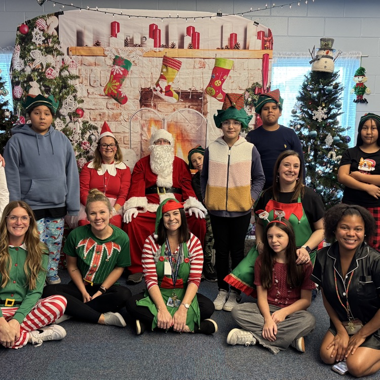 A class visits with Santa Claus at school