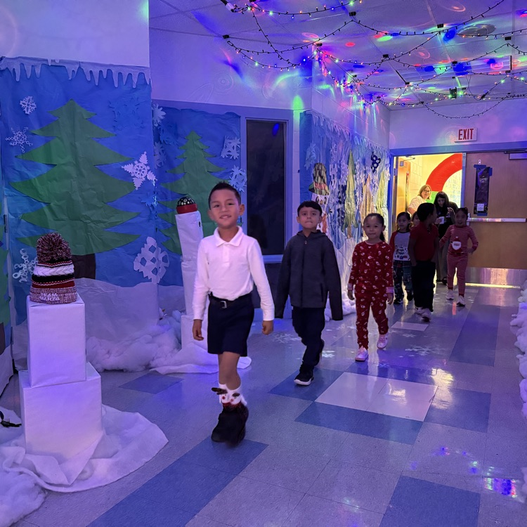 kids walking through a winter wonderland created at their school
