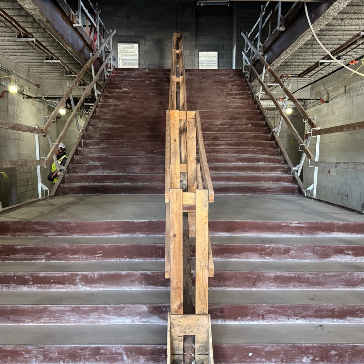 A grand stairway under construction at a new school