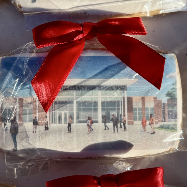 A cookie with a likeness of a new high school on it