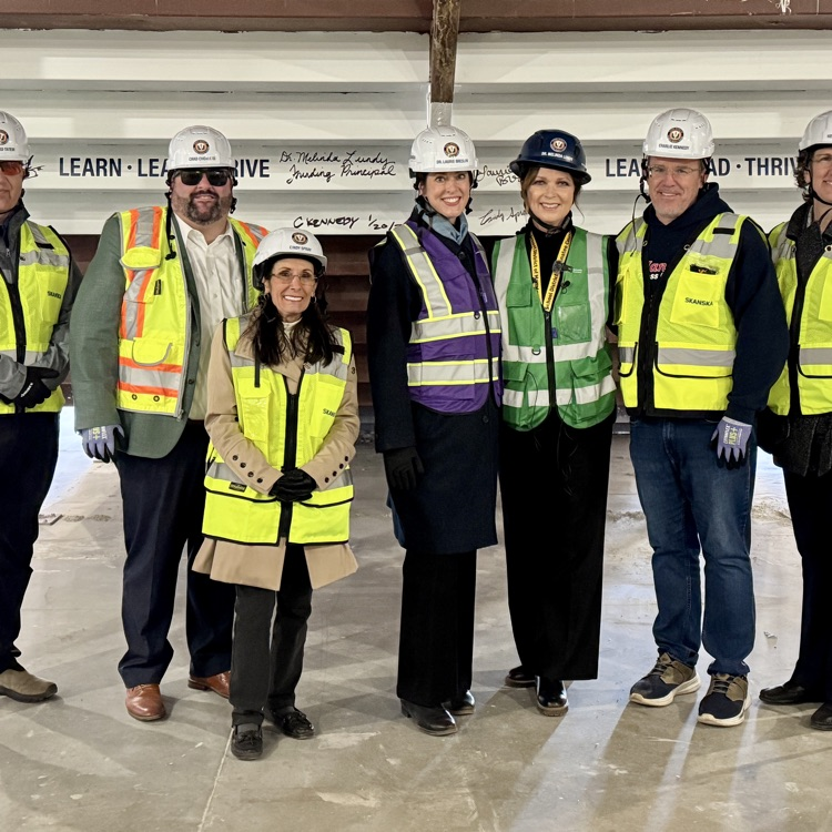 School board members taking a tour of a school under construction