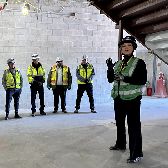 Principal Lundy speaks to the tour group.