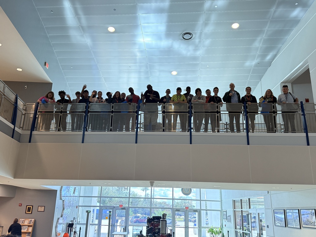 Students on a field trip at Manatee Technical College stand on the second floor.