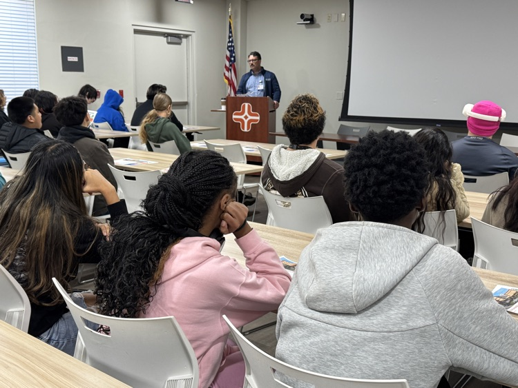 Student students listen to healthcare professionals speak about career opportunities